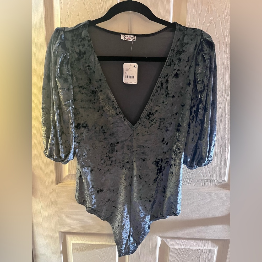 Super soft  Free People bodysuit. Has very cute shoulders